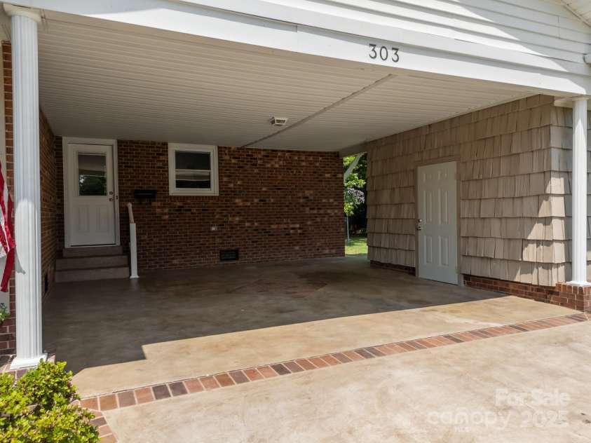 303 Jean Avenue, Kannapolis, NC 28083.  MLS# CAR4264386, YatesRealty ID 26651. Double Carport with Storage