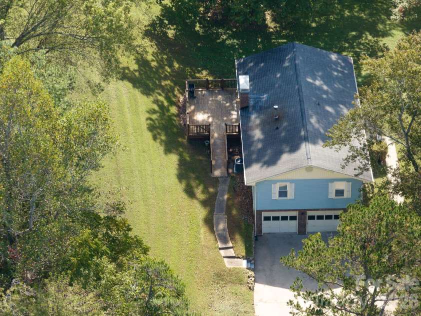 16 Sun Valley Court, Alexander, NC 28701.  MLS# CAR4263633, YatesRealty ID 26660. Back deck drone view