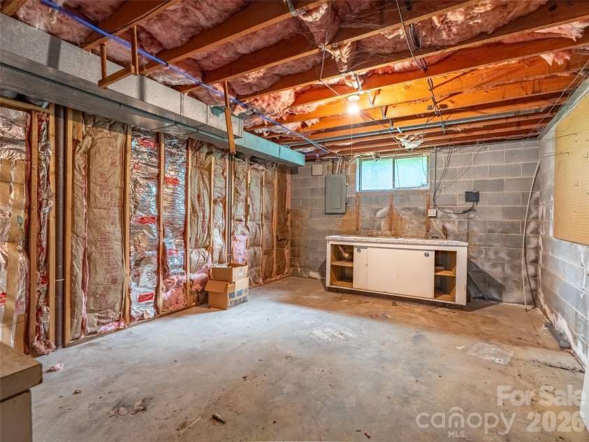 16 Sun Valley Court, Alexander, NC 28701.  MLS# CAR4263633, YatesRealty ID 26660. Large workshop in basement