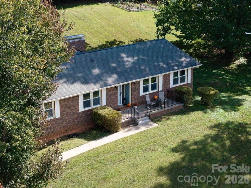 16 Sun Valley Court, Alexander, NC 28701.  MLS# CAR4263633, YatesRealty ID 26660. Shade trees, large front yard