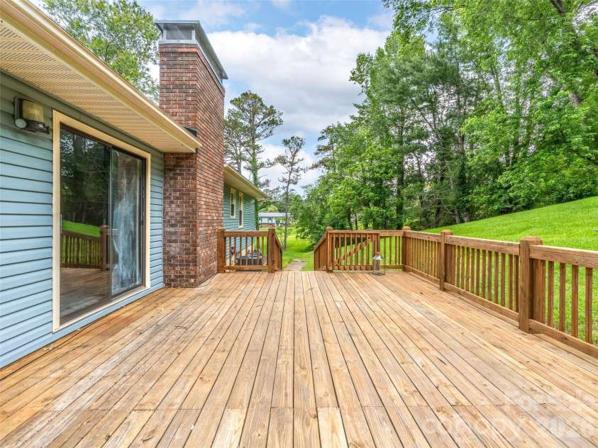 16 Sun Valley Court, Alexander, NC 28701.  MLS# CAR4263633, YatesRealty ID 26660. Spacious back deck for entertaining and grilling