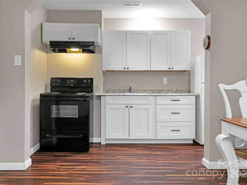 3703 Connestee Trail, Brevard, NC 28712.  MLS# CAR4215102, YatesRealty ID 26660. Downstairs kitchenette in the possible Guest/Mother-in-law Suite