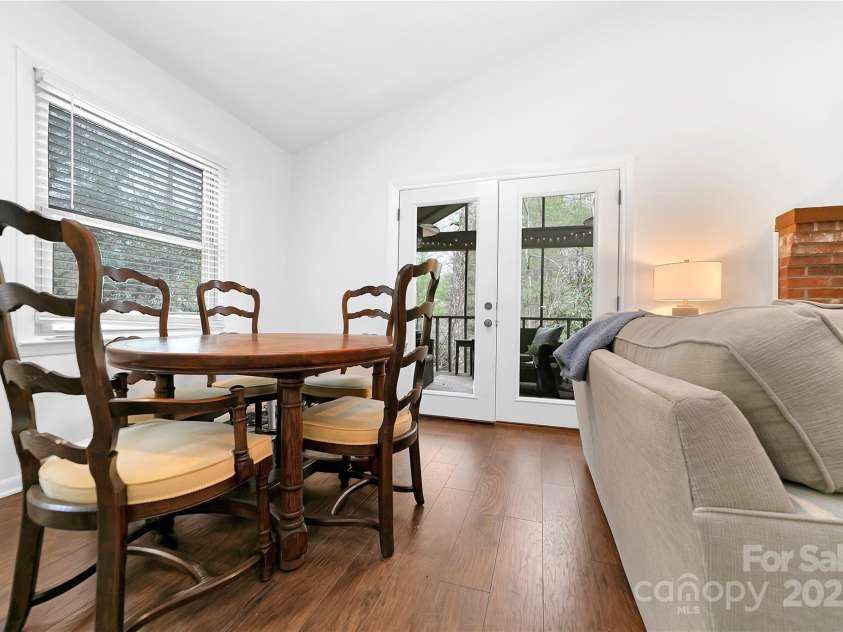 3703 Connestee Trail, Brevard, NC 28712.  MLS# CAR4215102, YatesRealty ID 26660. Entrance to the Screen Porch is via the Dining Area