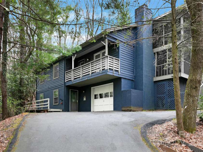 3703 Connestee Trail, Brevard, NC 28712.  MLS# CAR4215102, YatesRealty ID 26660. Home with single car garage and possible Guest/In-law suite in the downstairs with a private entrance.
