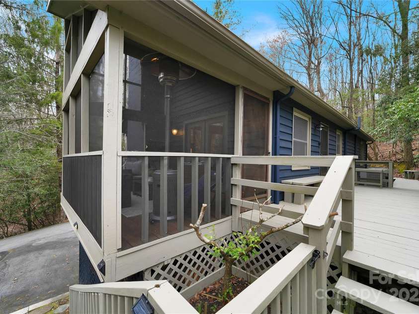 3703 Connestee Trail, Brevard, NC 28712.  MLS# CAR4215102, YatesRealty ID 26660. Screened in porch off the main living area.