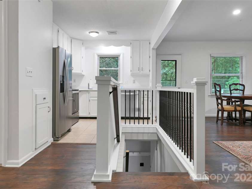 3703 Connestee Trail, Brevard, NC 28712.  MLS# CAR4215102, YatesRealty ID 26660. Stairwell to the basement Guest quarters/In-law suite.