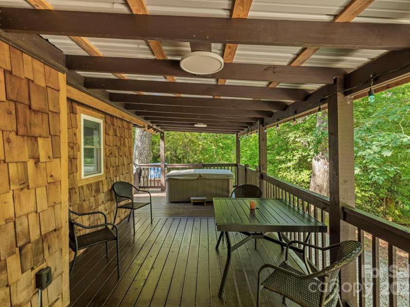 40 Squirrel Lane, Sapphire, NC 28774.  MLS# CAR4272442, YatesRealty ID 26666. Enjoy the Breeze and the Hot Tub