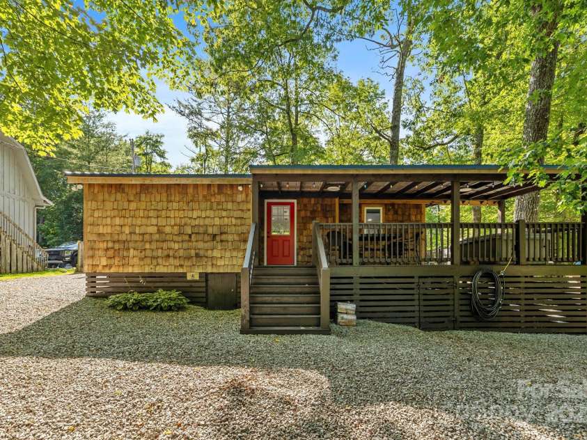 40 Squirrel Lane, Sapphire, NC 28774.  MLS# CAR4272442, YatesRealty ID 26666. Rear Entrance to Covered Wraparound Porch