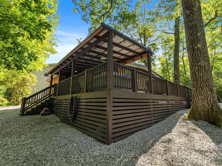 40 Squirrel Lane, Sapphire, NC 28774.  MLS# CAR4272442, YatesRealty ID 26666. Upgraded Decking and Skirting