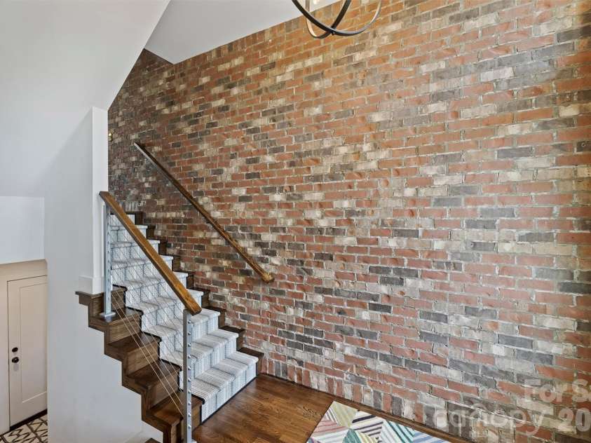 2829 Brevard Street, Charlotte, NC 28205.  MLS# CAR4364948, YatesRealty ID 26667. Interior brick wall adds so much character
