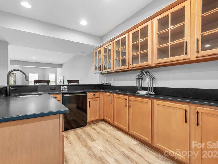 7191 Grist Mill Court, Denver, NC 28037.  MLS# CAR4221551, YatesRealty ID 26668. Basement Bar with sink and dishwasher