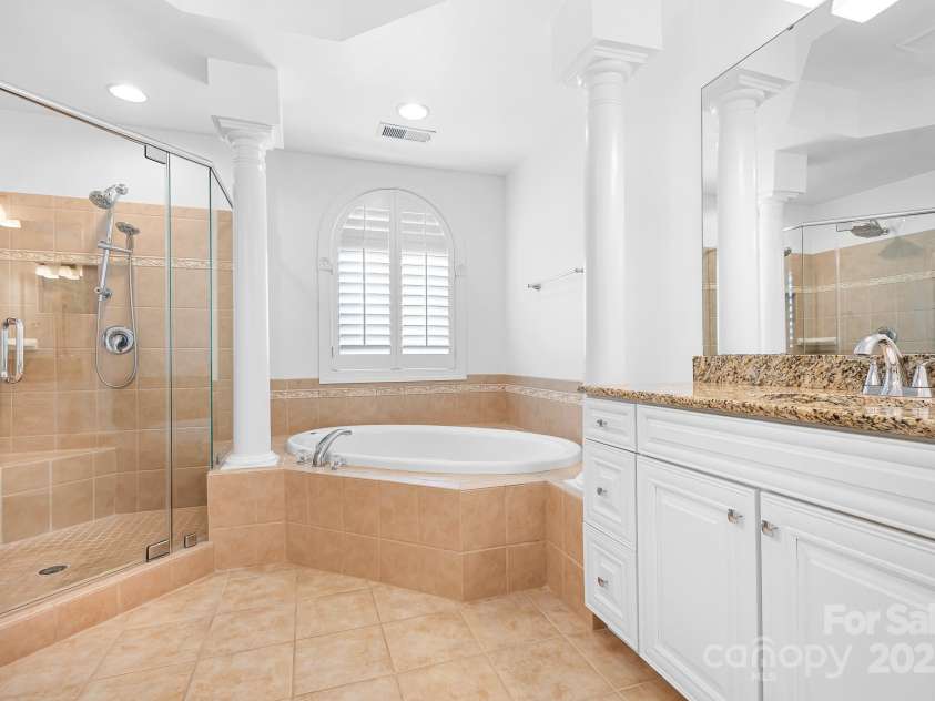7191 Grist Mill Court, Denver, NC 28037.  MLS# CAR4221551, YatesRealty ID 26668. Primary en-suite with double vanities, soaking tub and tile shower