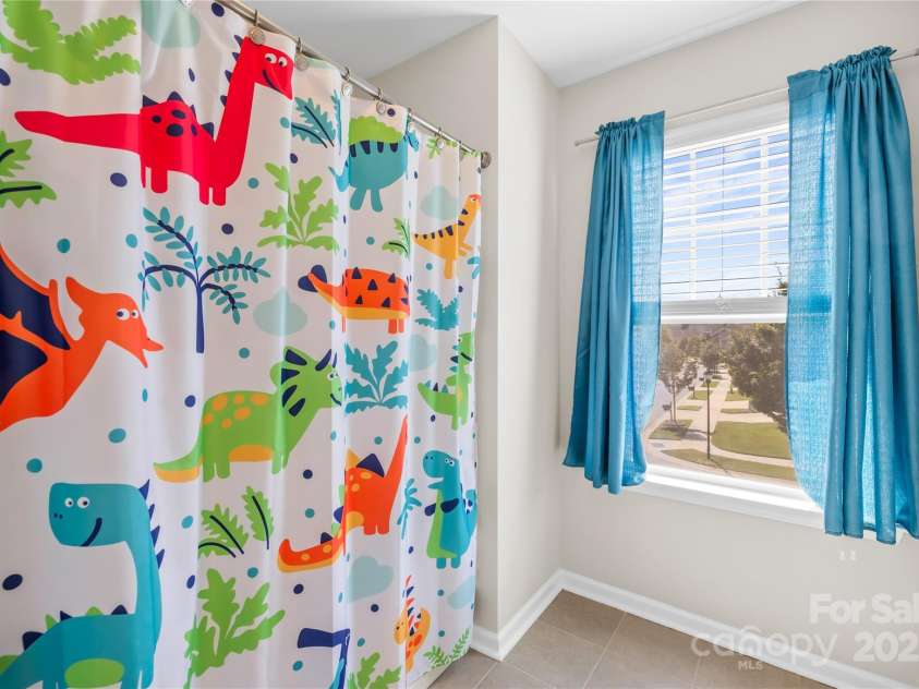 183 Rustling Waters Drive, Mooresville, NC 28117.  MLS# CAR4303069, YatesRealty ID 2667. Hall bath has tub shower combo