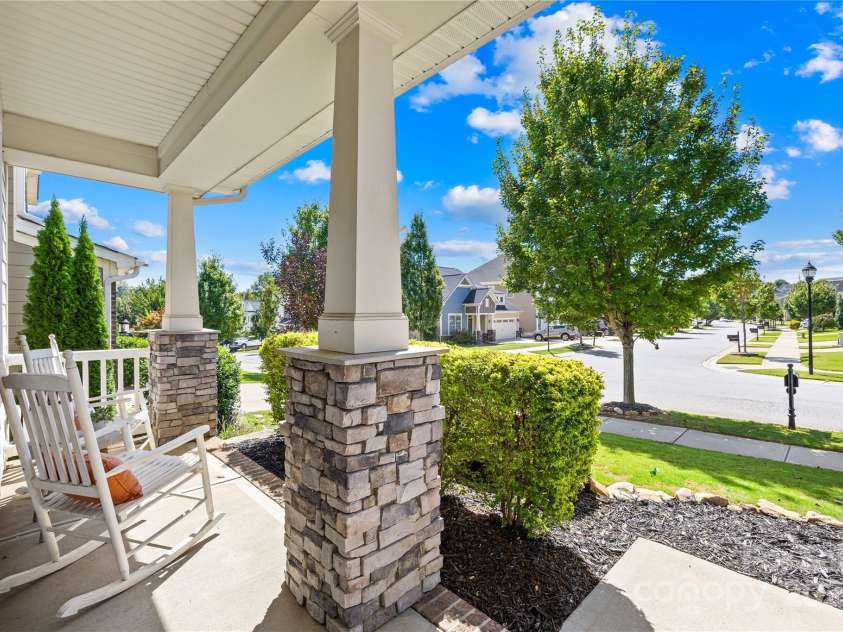 183 Rustling Waters Drive, Mooresville, NC 28117.  MLS# CAR4303069, YatesRealty ID 2667. Perfect porch for rocking chairs