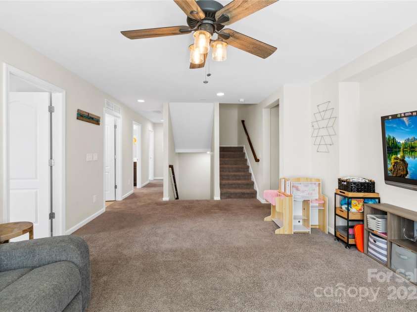 183 Rustling Waters Drive, Mooresville, NC 28117.  MLS# CAR4303069, YatesRealty ID 2667. Stairs to third floor which could be finished!