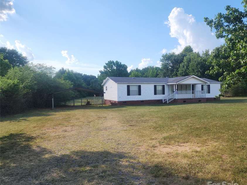 933 Osteen Road, York, SC 29745.  MLS# CAR4281275, YatesRealty ID 26671. 2 Car Carport, Storage Building and rear fencing