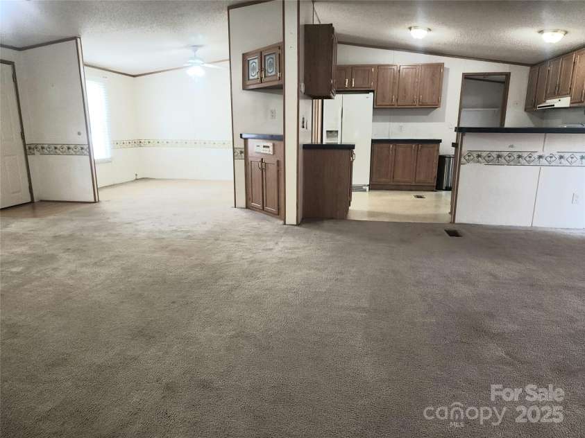 933 Osteen Road, York, SC 29745.  MLS# CAR4281275, YatesRealty ID 26671. Great Room, Kitchen, Dining Room View
