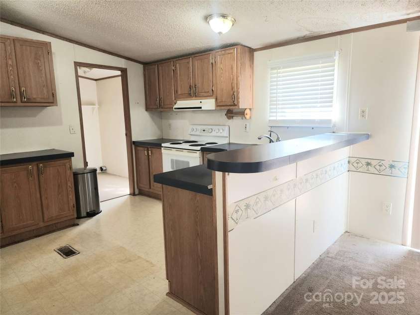 933 Osteen Road, York, SC 29745.  MLS# CAR4281275, YatesRealty ID 26671. Kitchen has breakfast bar area