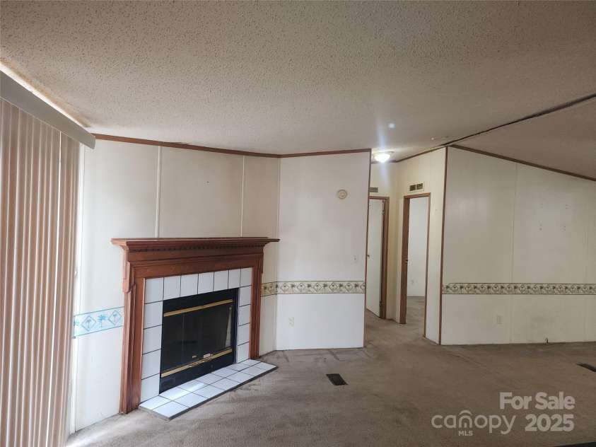 933 Osteen Road, York, SC 29745.  MLS# CAR4281275, YatesRealty ID 26671. Wood burning Fireplace by Patio Sliding Door