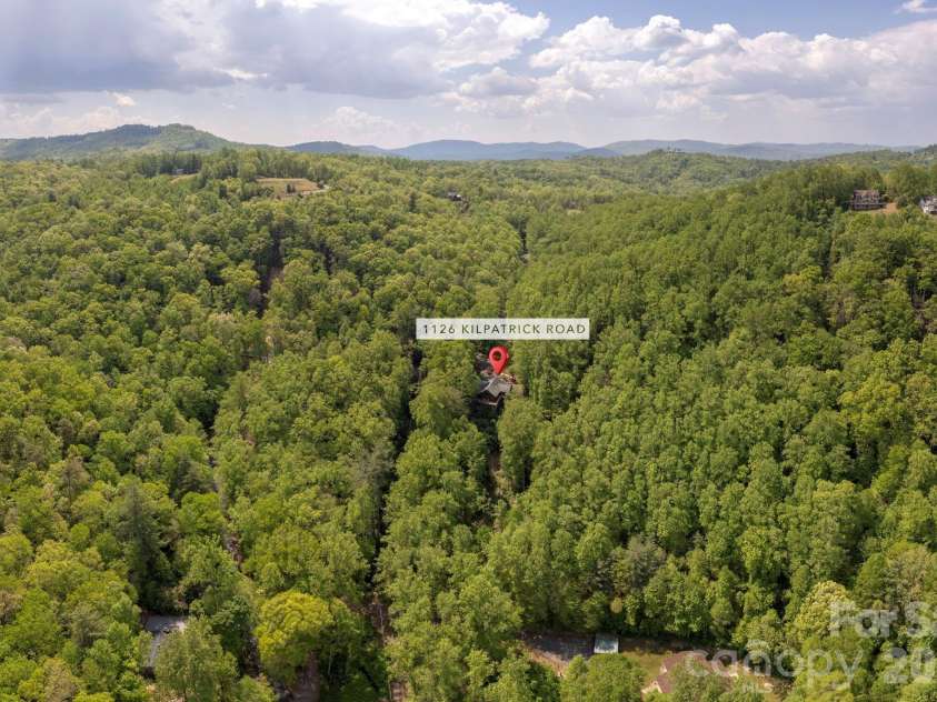 1126 Kilpatrick Road, Hendersonville, NC 28739.  MLS# CAR4384744, YatesRealty ID 26672. Aerial view with mountains beyond!