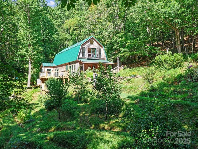 2490 US 80 Highway, Burnsville, NC 28714.  MLS# CAR4282852, YatesRealty ID 26673. View of the House Over the Terraced Garden