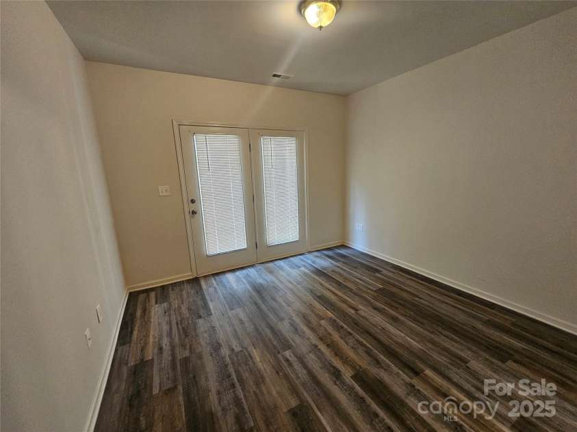 606 North Street, Belmont, NC 28012.  MLS# CAR4265350, YatesRealty ID 26675. Unit A- Bedroom with laminate flooring