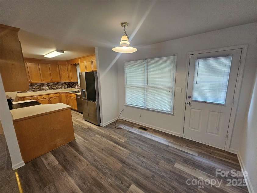 606 North Street, Belmont, NC 28012.  MLS# CAR4265350, YatesRealty ID 26675. Unit A dining area off kitchen