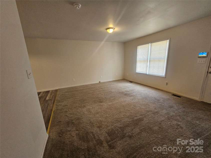 606 North Street, Belmont, NC 28012.  MLS# CAR4265350, YatesRealty ID 26675. Unit A spacious living rrom