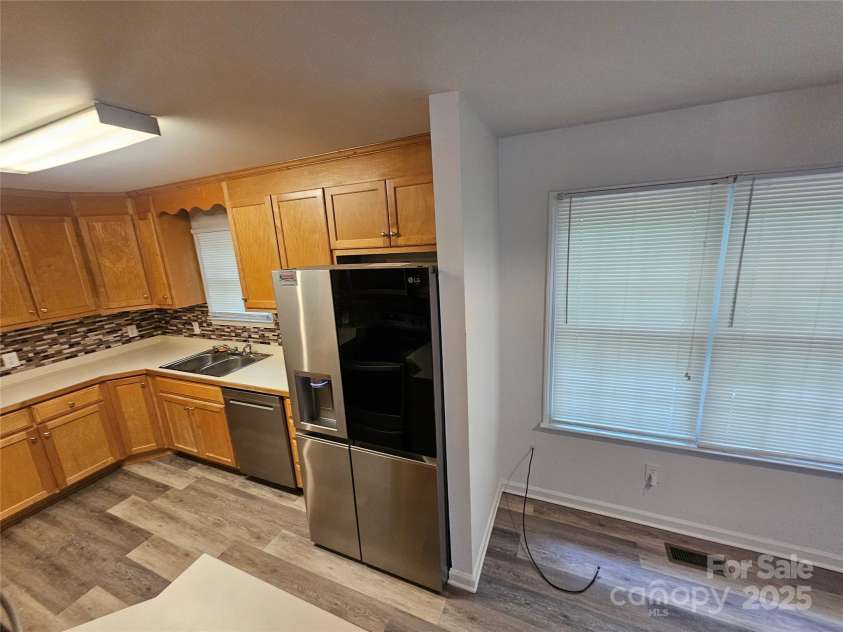 606 North Street, Belmont, NC 28012.  MLS# CAR4265350, YatesRealty ID 26675. Unit A-stainless steel refrigerator