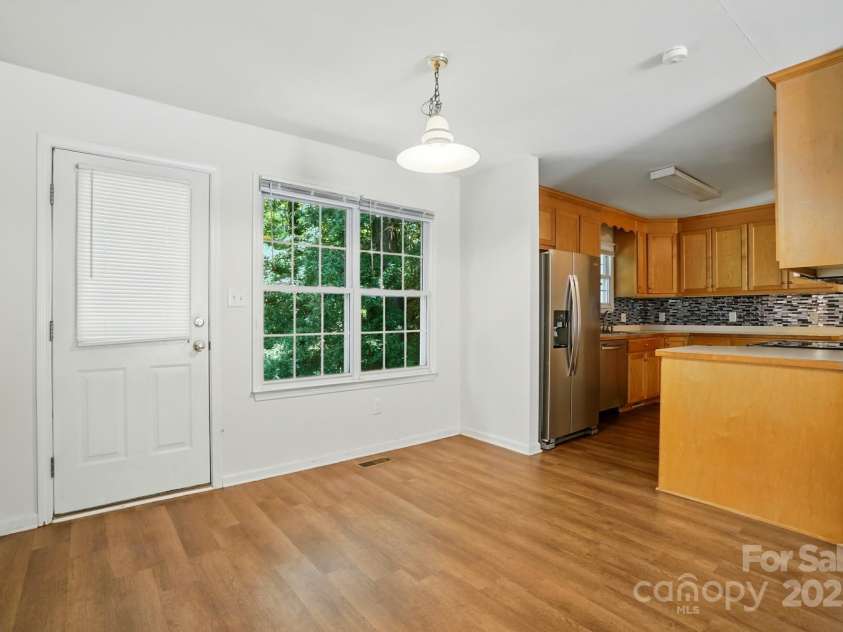606 North Street, Belmont, NC 28012.  MLS# CAR4265350, YatesRealty ID 26675. Unit B dining area has vinyl flooring