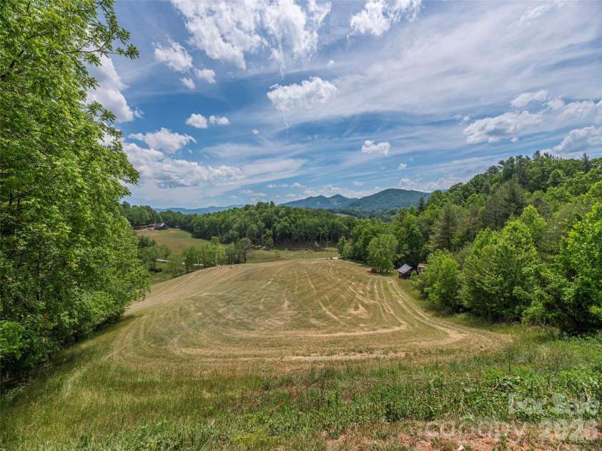 461 Ferguson Cove Loop, Clyde, NC 28721.  MLS# CAR4354575, YatesRealty ID 26678. 11 Acres of mostly Pasture - perfect for future growth or mini farm, includes barn
