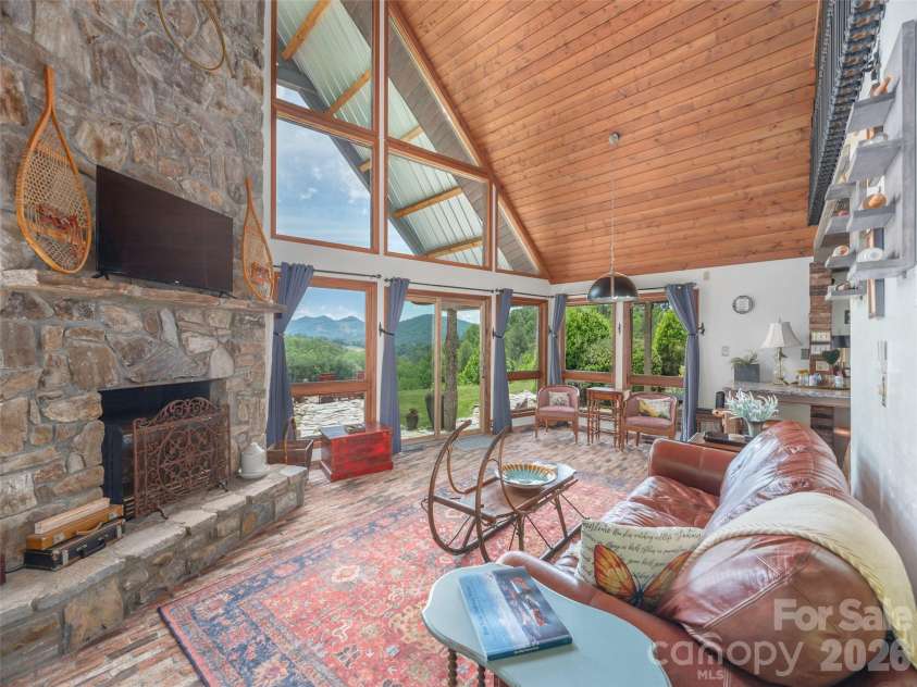 461 Ferguson Cove Loop, Clyde, NC 28721.  MLS# CAR4354575, YatesRealty ID 26678. Amazing great room for gathering and relaxing by the fireplace