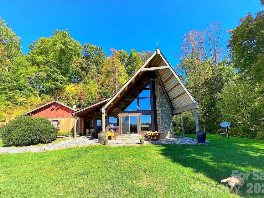461 Ferguson Cove Loop, Clyde, NC 28721.  MLS# CAR4354575, YatesRealty ID 26678. Chalet and Three Car Garage