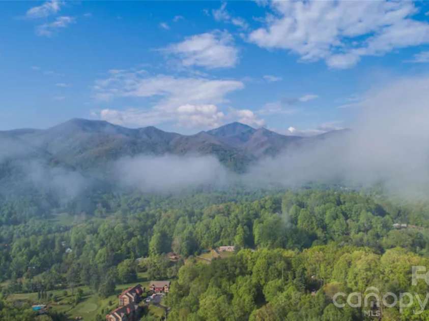 461 Ferguson Cove Loop, Clyde, NC 28721.  MLS# CAR4354575, YatesRealty ID 26678. Outstanding views year round, all seasons and time of day