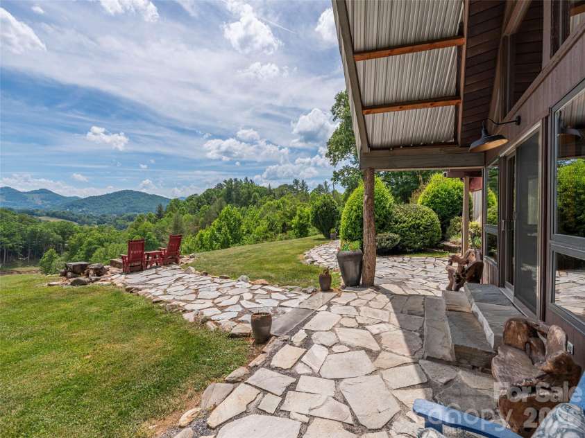 461 Ferguson Cove Loop, Clyde, NC 28721.  MLS# CAR4354575, YatesRealty ID 26678. Prime Views inside, outside and surrounding on the level top knoll.