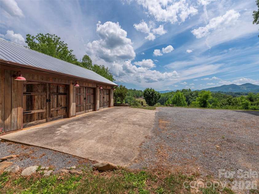 461 Ferguson Cove Loop, Clyde, NC 28721.  MLS# CAR4354575, YatesRealty ID 26678. Three car garage for hobbies and vehicles