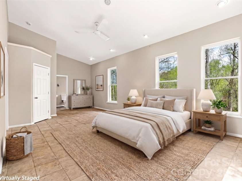 76 Raven Rock Lane, Marshall, NC 28753.  MLS# CAR4369847, YatesRealty ID 26680. 2nd main level bedroom with ensuite bath.