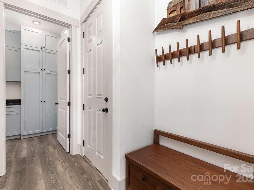 19031 Brandon James Drive, Cornelius, NC 28031.  MLS# CAR4256290, YatesRealty ID 26681. Drop zone and laundry with wonderful storage cabinets