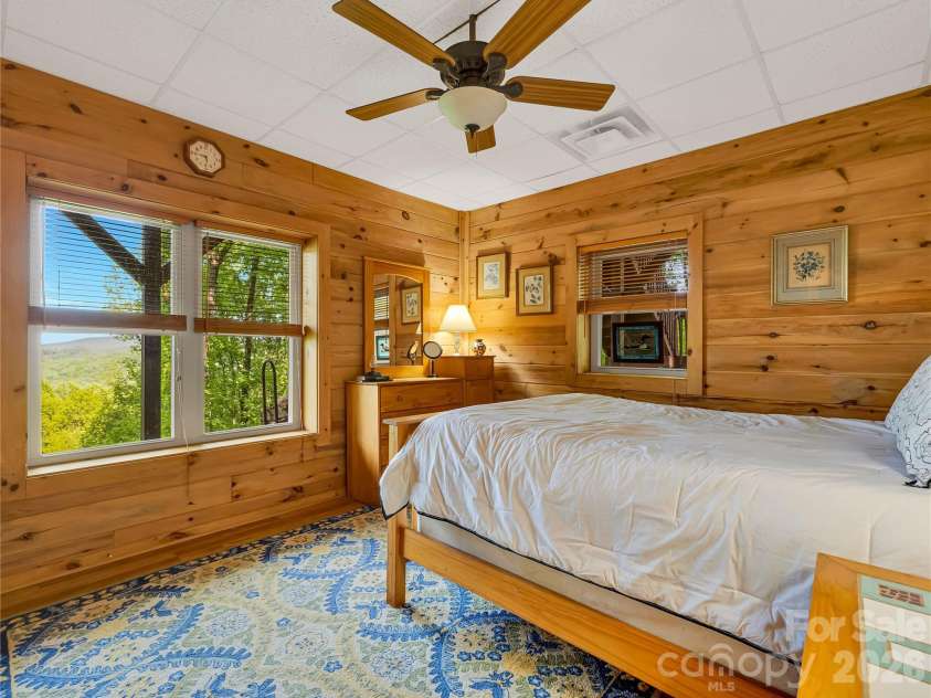 586 Tanglewood Lane, Saluda, NC 28773.  MLS# CAR4376488, YatesRealty ID 26681. Lower-Level Bedroom with Long-range View