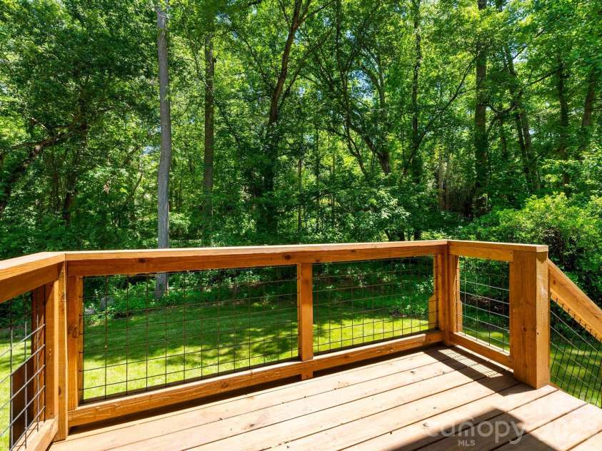 17 Muirfield Drive, Arden, NC 28704.  MLS# CAR4383147, YatesRealty ID 26683. Lower deck with access to the yard