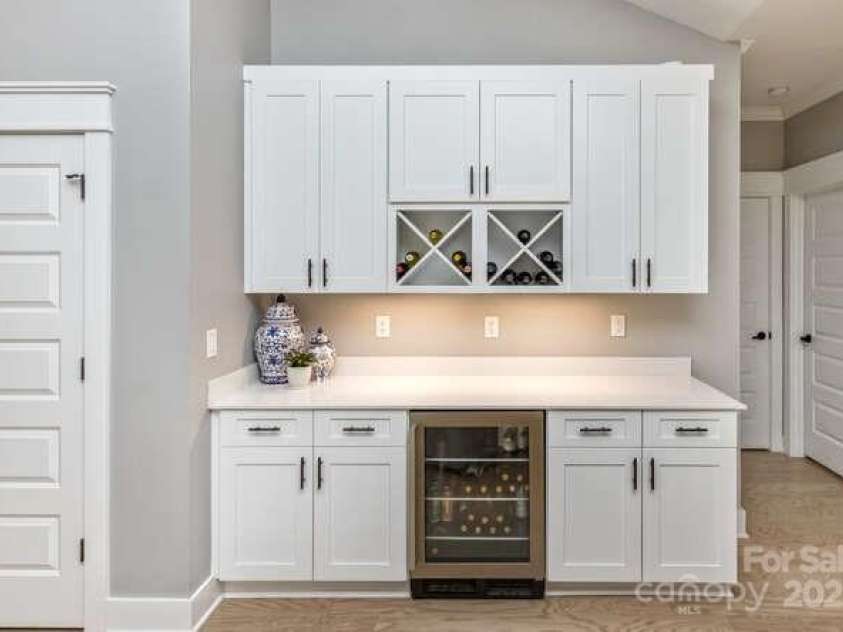 207 Weybridge Drive, Arden, NC 28704.  MLS# CAR4276562, YatesRealty ID 26705. Custom cabinetry with beverage fridge