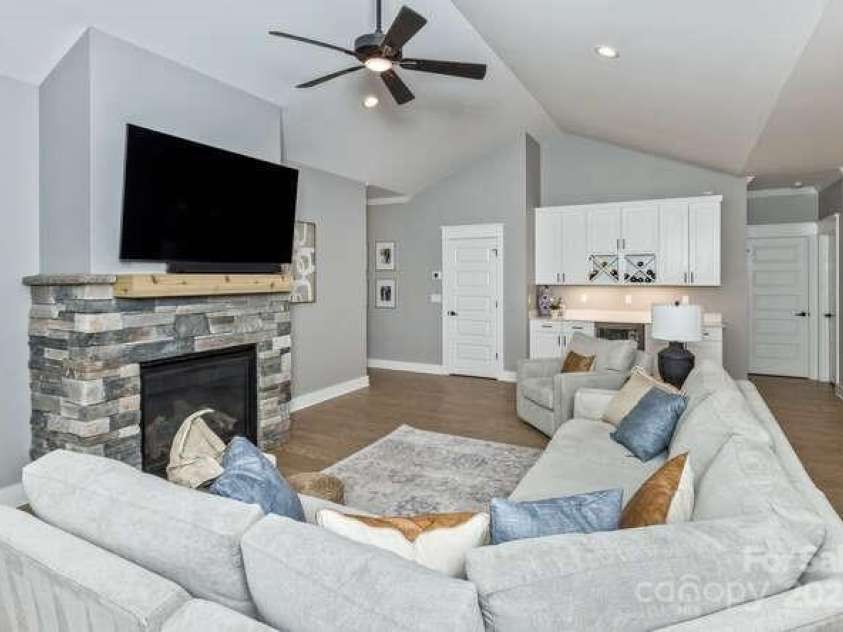 207 Weybridge Drive, Arden, NC 28704.  MLS# CAR4276562, YatesRealty ID 26705. Living room w/fireplace