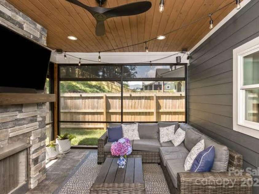207 Weybridge Drive, Arden, NC 28704.  MLS# CAR4276562, YatesRealty ID 26705. Screened in back porch