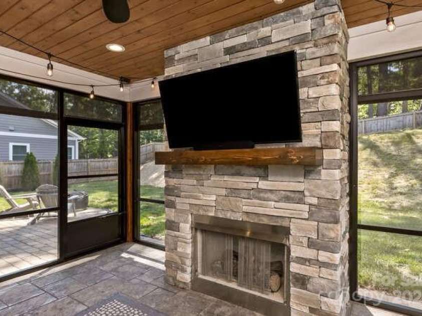 207 Weybridge Drive, Arden, NC 28704.  MLS# CAR4276562, YatesRealty ID 26705. Screened in back porch