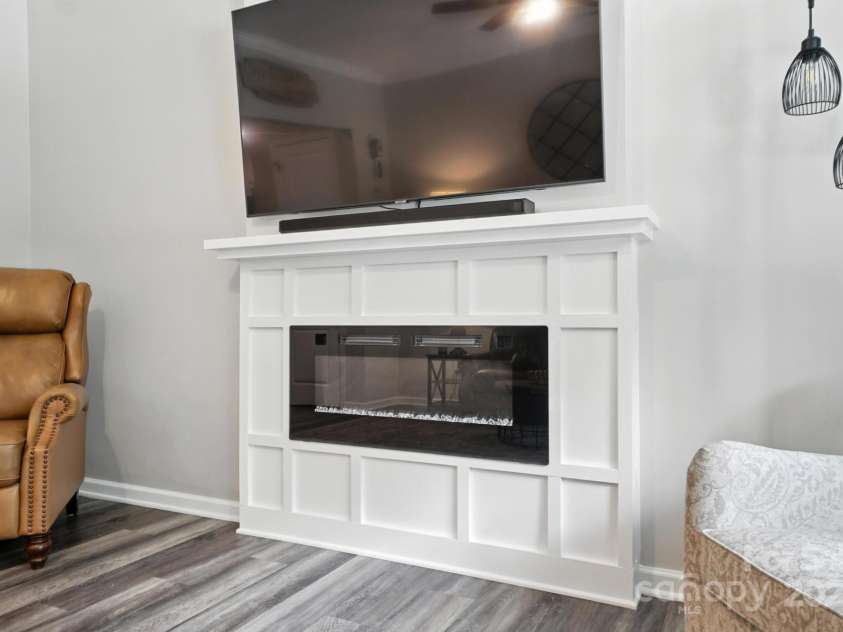 280 Mills Creek Road, Iron Station, NC 28080.  MLS# CAR4277070, YatesRealty ID 26706. Electric fireplace.