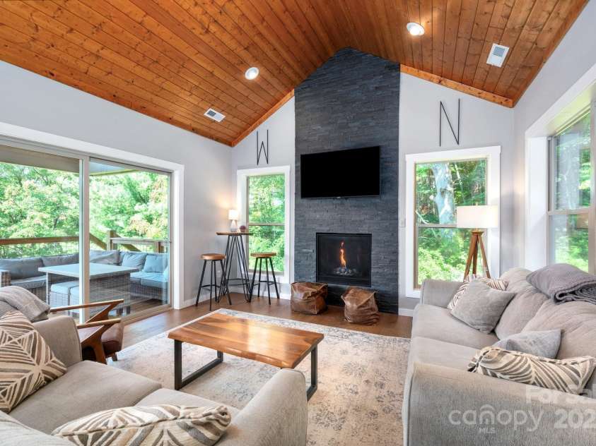 54 Weldon Way, Fairview, NC 28730.  MLS# CAR4279261, YatesRealty ID 26712. Beautiful Vaulted Living Space with Floor-to-Ceiling Fireplace