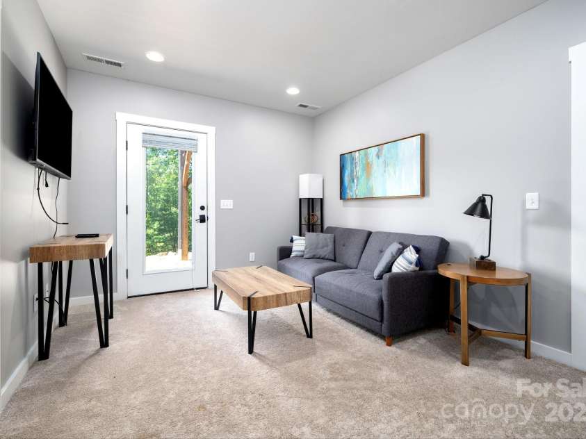 54 Weldon Way, Fairview, NC 28730.  MLS# CAR4279261, YatesRealty ID 26712. Living/Gathering Space in Lower Level