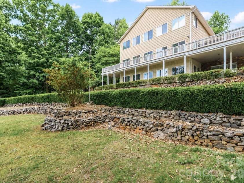 113 Tinker Place, Troutman, NC 28166.  MLS# CAR4384005, YatesRealty ID 26717. Back of hom
