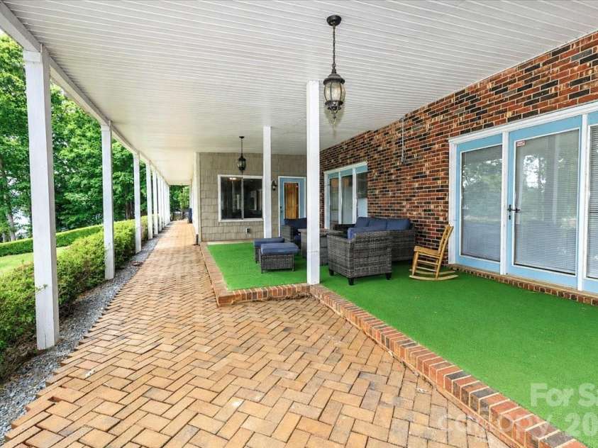 113 Tinker Place, Troutman, NC 28166.  MLS# CAR4384005, YatesRealty ID 26717. Covered patio basement
