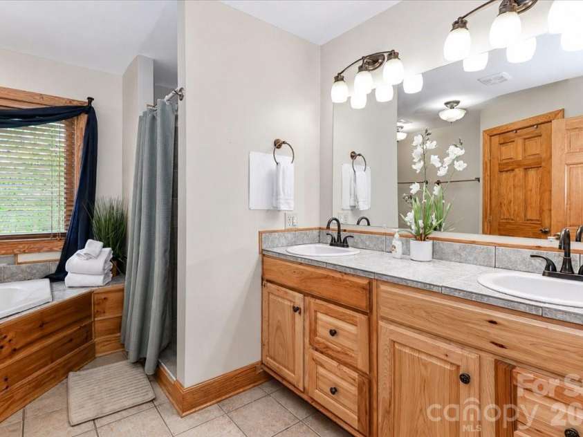 113 Tinker Place, Troutman, NC 28166.  MLS# CAR4384005, YatesRealty ID 26717. Primary bathroom